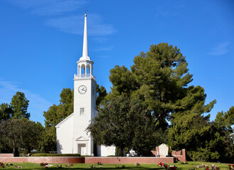 old fashioned country church with clock bell tower