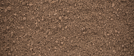 loosened soil as a background. brown ground surface