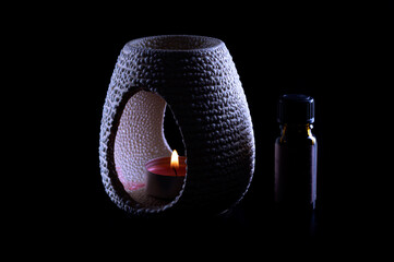 Aroma therapy lamp against a black background