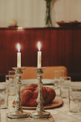 Shabbat candles on a friday dinner table