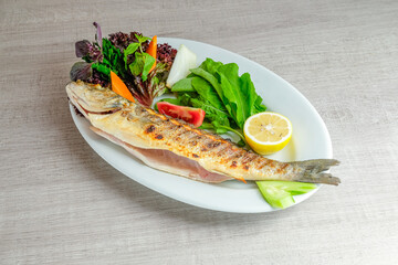 Grilled laurick fish with vegetables