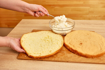 Adding the filling to the cake. Cooking a festive pie at home