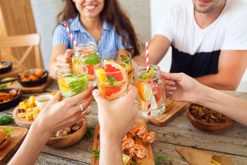 Hands with soft drink, lemonade