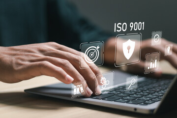 ISO 9001 Standard certification standardisation quality control concept, businessman use laptop with virtual screen of ISO 9001 icons for quality management of organizations. - obrazy, fototapety, plakaty