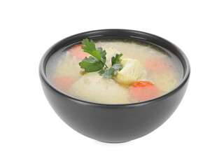 Tasty chicken soup with carrot and parsley in bowl isolated on white