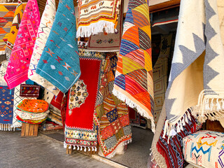  Colorful moroccan carpets with oriental ornaments for sale on a street shop in loudaya's old city...