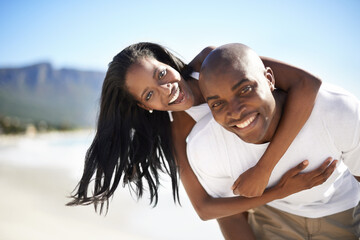 Piggyback, love and portrait of black couple at the beach for valentines day vacation, holiday or...