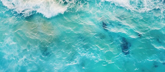 Naklejka premium Aerial view of serene turquoise sea surface.