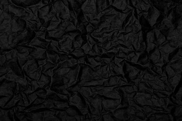 Black wrinkled paper texture background