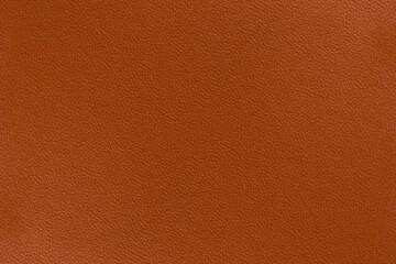 Texture of bright orange full grain leather