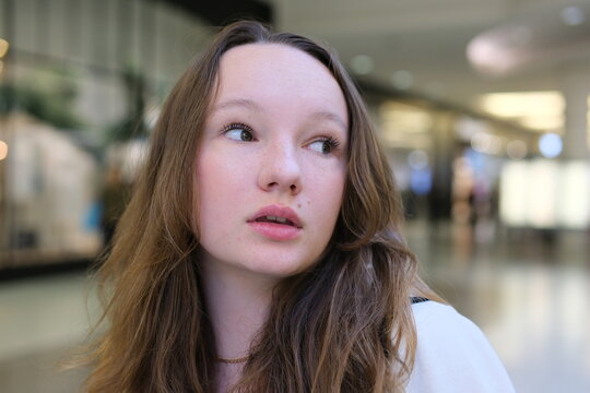 Sad brooding teenage girl portrait. Without makeup, the real person