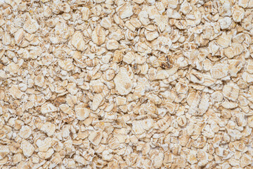 Oat flakes background, flat lay view from above with copy space for text.