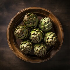 Obraz premium Freshly Picked Artichoke Hearts Arranged in a Rustic Wooden Bowl