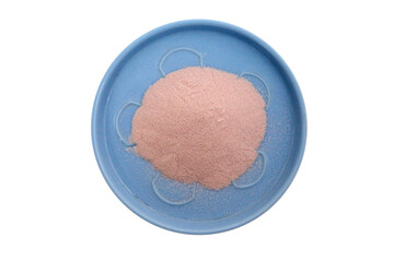 light pink powdered flour in a blue coaster on a white background