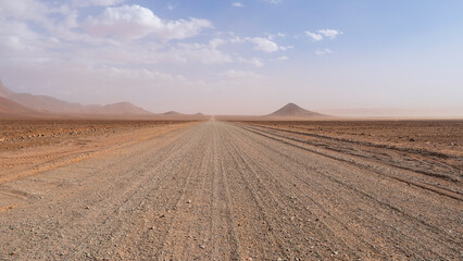Driving through a gravel road in Namibia and enjoying the out-of-this-world scenery