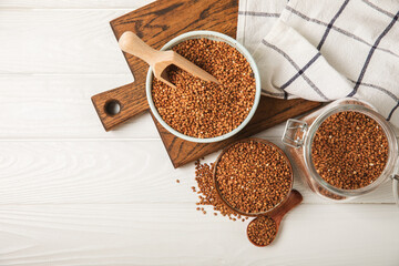 Raw buckwheat in a bowl on a textured background.Wheat grains, porridge, cereals, raw buckwheat in a plate. Healthy food. Porridge. Diet. Organic cerea. Space for text.Copy space.