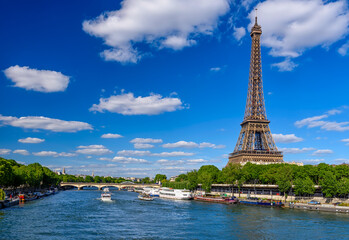 Paris Eiffel Tower and river Seine in Paris, France. Eiffel Tower is one of the most iconic...