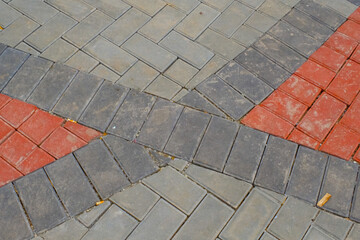 Background Photography. Textured Backgrounds. Detail of road texture with paving blocks. Square paving blocks painted in gray and red. Bandung, Indonesia