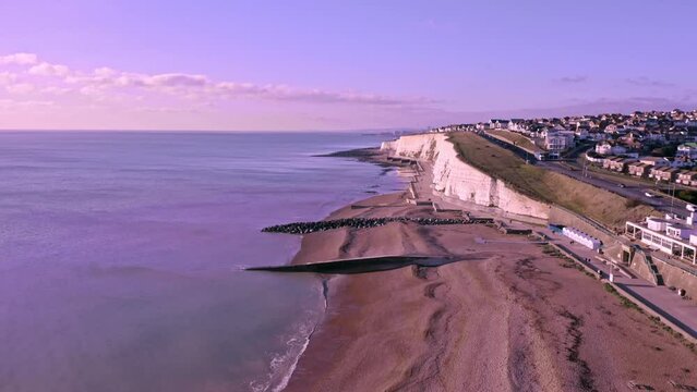 Aerial video of the White Chalk Cliffs at Saltdean in East Sussex heading west towards Rottingdean with Brighton in view in the distance.