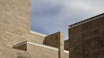 Fototapeta na wymiar modern facade of geometric forms against the sky