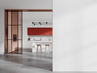 White and red kitchen with island and blank wall