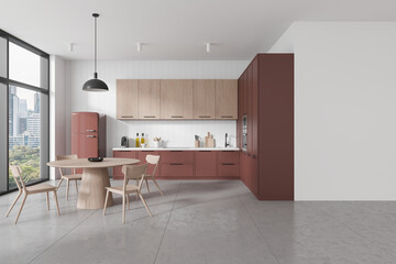 Stylish home kitchen interior with eating table and cooking cabinet near window