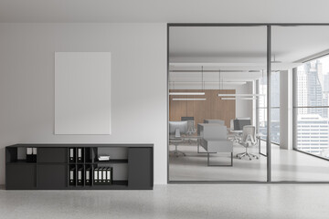 White open space office interior with poster and cabinet