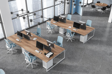 Top view of office interior with coworking and meeting corner, panoramic window