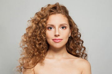 Elegant woman fashion model with long wavy hairstyle, natural makeup and clear skin. Haircare, facial treatment and skincare concept - obrazy, fototapety, plakaty