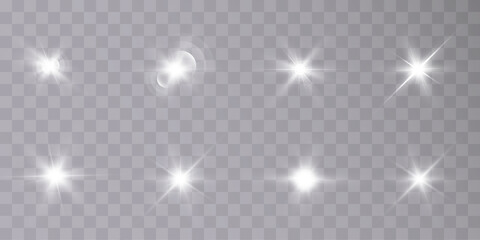 A set of light on a transparent background sparkles a shiny magic star. Glittering star, vector glowing star light effect.