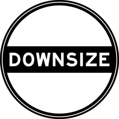Black color round seal sticker in word downsize on white background