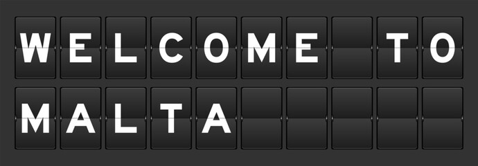 Black color analog flip board with word welcome to malta on gray background