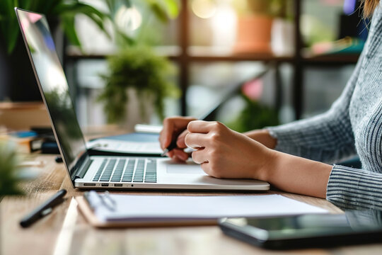 A person taking notes during a virtual workshop or seminar.