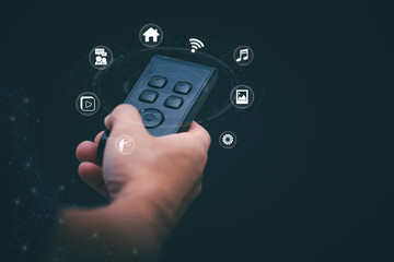 Concepts of using digital media, social media Surfing online, male hand using remote control To play or use social media, the concept of working remotely, working from home via the internet.