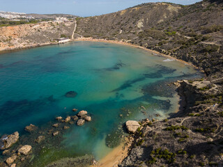 Obraz premium Ghajn Tuffieha Bay Malta Riviera beach aerial with beautiful rock formation in turquoise sea
