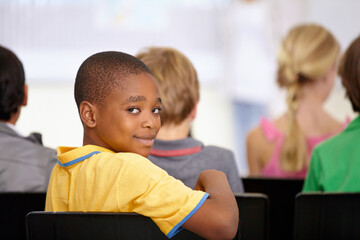 Portrait, black boy or student in classroom for knowledge, education or development for future...