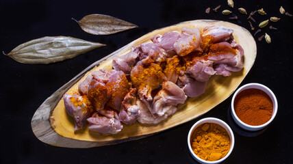 raw chicken is getting ready to be cooked 