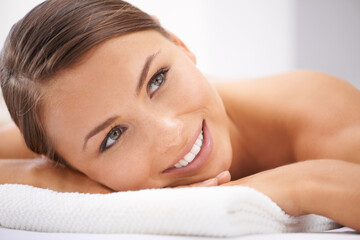 Obraz na płótnie Canvas Relax, smile and young woman at spa with body massage for health, wellness and self care. Happy, natural and female person with calm, peaceful and serene skin therapy treatment at beauty salon.