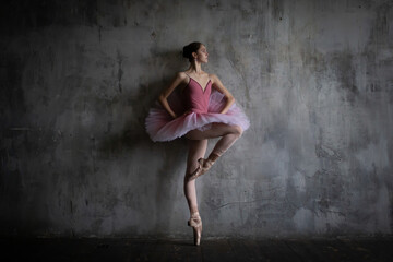 Ballerina in a pink suit in a ballet pose.