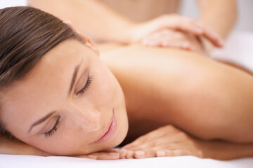 Woman, back massage at spa with aromatherapy and healing, physical therapy and wellness. Calm, natural and beauty with skincare, body care and health, holistic treatment for zen or stress relief