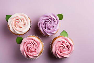 Romantic cupcakes with pastel colored buttercream shaped like a rose flowers
