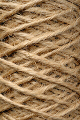 Roll of thin rough natural jute or hemp cord