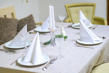 The table is ready for a wonderful lunch or dinner with napkins on the plates