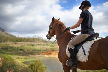 Equestrian, horse and woman riding in nature on adventure and journey in countryside. Ranch, animal...