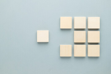 Abstract wooden blocks with only one piece move out of the row, final piece to complete, complement...