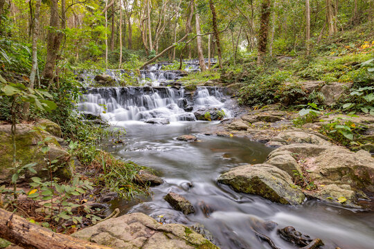 Panorama view of beautiful long exposure shot of waterfall in Namtok Samlan National Park, Saraburi, Thailand