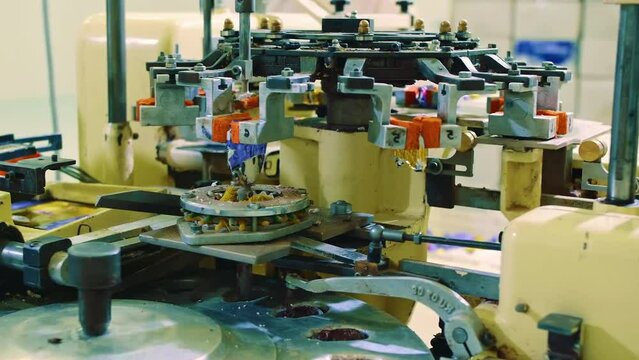 Conveyor belt in a chocolate factory. Candy packaging along the conveyor belt. Candy production. Chocolate pouring. Confectionery factory for confectionery production.