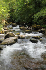 Closeup of small waterfalls on the East Lyn River, Devon, England
