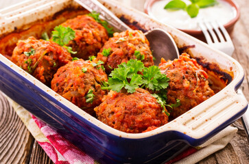 Traditional Persian slow cooked koofteh nokhod-chi meatballs with yoghurt served as close-up in a...