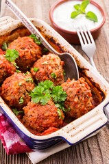 Traditional Persian slow cooked koofteh nokhod-chi meatballs with yoghurt served as close-up in a...